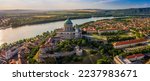 Small photo of Esztergom, Hungary - Aerial panoramic view of Primatial Basilica of the Blessed Virgin Mary Assumed Into Heaven (Basilica of Esztergom) on a summer day with blue clouds and River Danube at backgroud