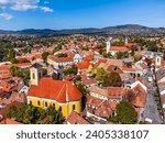 Small photo of Szentendre, Hungary - Aerial view of Saint Peter and Paul Church on a sunny day with Saint John the Baptist's Parish Church, Blagovestenska Church, Saint Peter and Paul Church and clear blue sky