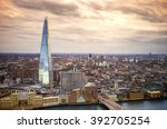 England - Skyline of South London with London Bridge, Shard skyscraper and River Thames - United Kingdom with beautiful golden sky