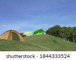 Camping Tents On Green Meadow...