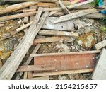 Small photo of old pile unused wood. unwanted wood at construction site. wood garbage. unused material from construction site.