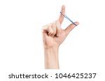 Hand playing with elastic hair band, isolated on white background