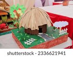 Small photo of close up of a diorama of a typical Indonesian traditional house made of used ice cream sticks made by junior high school students