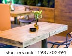 A Square Wooden Table With...