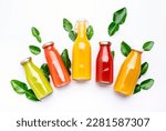 Small photo of Citrus fruit juices, fresh and smoothies, food background, top view. Mix of different whole and cut fruits: orange, grapefruit, lime, tangerine with leaves and bottles with drinks on white table