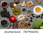 Food sources natural antioxidants. Antioxidants neutralize free radicals, have beneficial health effects. Group includes minerals, carotenoids and vitamins. Small board with word antioxidant. Top view