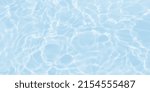 Small photo of de-focused. Closeup of light blue transparent clear calm water surface texture with splashes and bubbles. Trendy abstract summer nature background. for a product, advertising,text space.