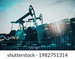 Oil pumping machinery in operation with barrels and digital screen with world map and financial chart graphs and indicators, natural resources stock market concept. Double exposure