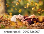 Cheerful Young Woman Lying Over ...