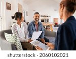 Small photo of Happy mature couple discussing investments with financial broker during meeting at home. Middle eastern man and woman discussing about financial planning with consultant at home. Financial consultant