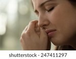 Close-up of young woman with problems crying