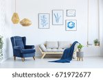 White Sofa And Blue Armchair In ...