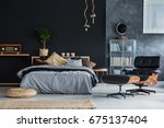 Wicker accessories in black and grey modern bedroom