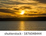 The sun set on the Puget Sound in Burien, Washington.
