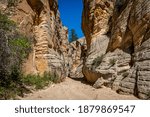 Lick Wash is a slot canyon whose rock walls are formed by water erosion from flash floods at Grand Staircase-Escalante National Monument in Kane County, Utah.