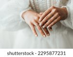 Small photo of Picture of man and woman with wedding ring.Young married couple holding hands, ceremony wedding day. Newly wed couple's hands with wedding rings.