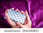 Small photo of Woman's hand shuffling tarot cards