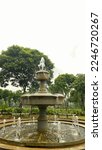 Small photo of fountain in the cemetery park called "TPU Kampung Kandang" in Jakarta, Indonesia