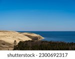 Small photo of Baltic sea from Curonian Spit. The Gray Dunes, or the Dead Dunes is sandy hills with a bit of green specks at the Lithuanian side of the Curonian Spit
