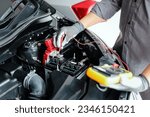 Small photo of Close-up hand auto mechanic using meter to check car battery fail problem to change repairing and fix car and maintenance servicing.