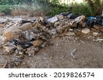 Small photo of terni,italy august 05 2021:illegal waste dumped by uncivilized people on the outskirts of the city