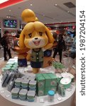Small photo of Tokyo, Japan: October 31, 2020 - Isabelle, Timmy and Tommy(Shizue, Mamekichi and Tsubukichi in Japanese) statues surrounded by Animal Crossing merchandise inside the Nintendo Store in Shibuya, Tokyo