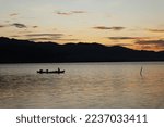 Two Fishermen On The Lake From...