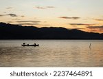 Two Fishermen On The Lake From...