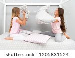 Small photo of Soulmates girls having fun sleepover party. Pillow fight pajama party. Sleepover time for fun. Best girls sleepover party ideas. Girls happy best friends in pajamas with pillows sleepover party.