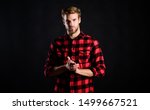 Small photo of Hipster black background. Standards of manliness or masculinity. Handsome well groomed man in checkered shirt. Manliness concept. Meaning of modern manliness. Male beauty, Barbershop and beauty salon.