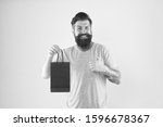 Small photo of pleasant prices here. cyber monday concept. little pleasantness. bearded man go shopping. store for men. mature male beard with purchase. happy hipster hold red paperbag. best offer. Man with package.