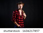 Small photo of heating up wild west. wild west rodeo. man in hat black background. man checkered shirt on ranch. Vintage style man. Wild West retro cowboy. cowboy with lasso rope. Western. western cowboy portrait.