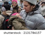 Small photo of KYIV, UKRAINE - Mar. 03, 2022: War of Russia against Ukraine. Civilians evacuated from Irpen town was transferd to Kyiv by Kyiv territorial defense battalion. War refugees in Ukraine