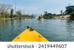 Small photo of MEKONG RIVER, LAOS - January 21, 2024. Unrecognizable kayaking into the Mekong river at the 4000 island in Laos.
