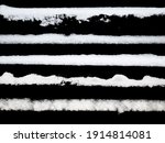set of strips of white snow isolated on a black background. High quality photo
