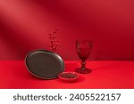 A black ceramic plate  a glass...