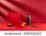 Close-up of a red gift box, a plate of jam, tangerines, lucky money envelopes and a vase of flowers. Empty space for product display. Front view.
