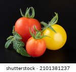 Tomatoes Isolated On A Black...