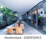 Small photo of SHANGHAI, CHINA -May 20. 2023:The green walls of the coffee shop and bar, fresh color collocation, very elegant.