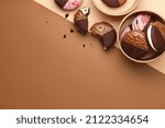 Small photo of American whoopie pie desserts in paper craft boxes on color background, copy space