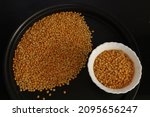 Small photo of Closeup of Arhar dal , Skinned Pigeon peas with black background