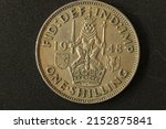 Small photo of Closeup of One Shilling coin of UK , minted in 1948.