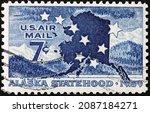 Small photo of Milan, Italy - November 10, 2021: Alaska statehood on vintage american postage stamp
