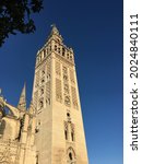 Small photo of La Giralda, the bell tower of the Cathedral of Seville, Sevilla, Spain.