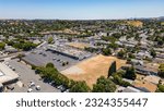 Small photo of Antioch, California USA June 28, 2023: Aerial images over a commercial property with a vacant field
