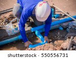 Construction Worker Repairing A ...