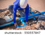 Construction Worker Repairing A ...