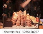 Process of baking trdelnik - traditional czech spit cake