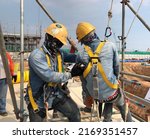 Small photo of Eastern, Thailand - 17 June 2022: Worker is rescued from manhole during working on confined space by safety tripod, fainting.