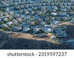 Late afternoon aerial view of hilltop suburban homes near Los Angeles in Simi Valley, California.